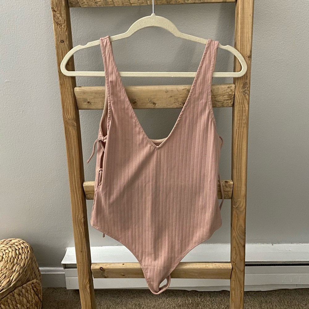 Mauve colored side tie body suit